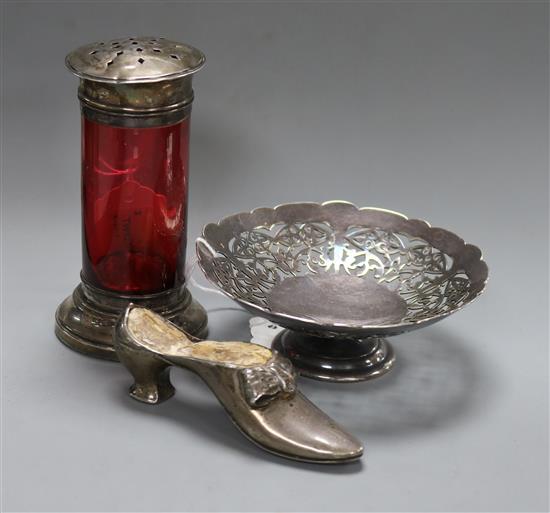 A silver shoe pin cushion, Adie & Lovekin, Chester 1922 (a.f.), a silver-mounted ruby glass sugar caster and a plated bon bon dish